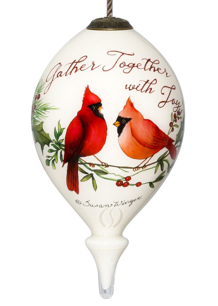 White glass finial ornament with two cardinals perched on a branch with holly and berries, inscribed "Gather Together with Joy" and "Susan Winget".