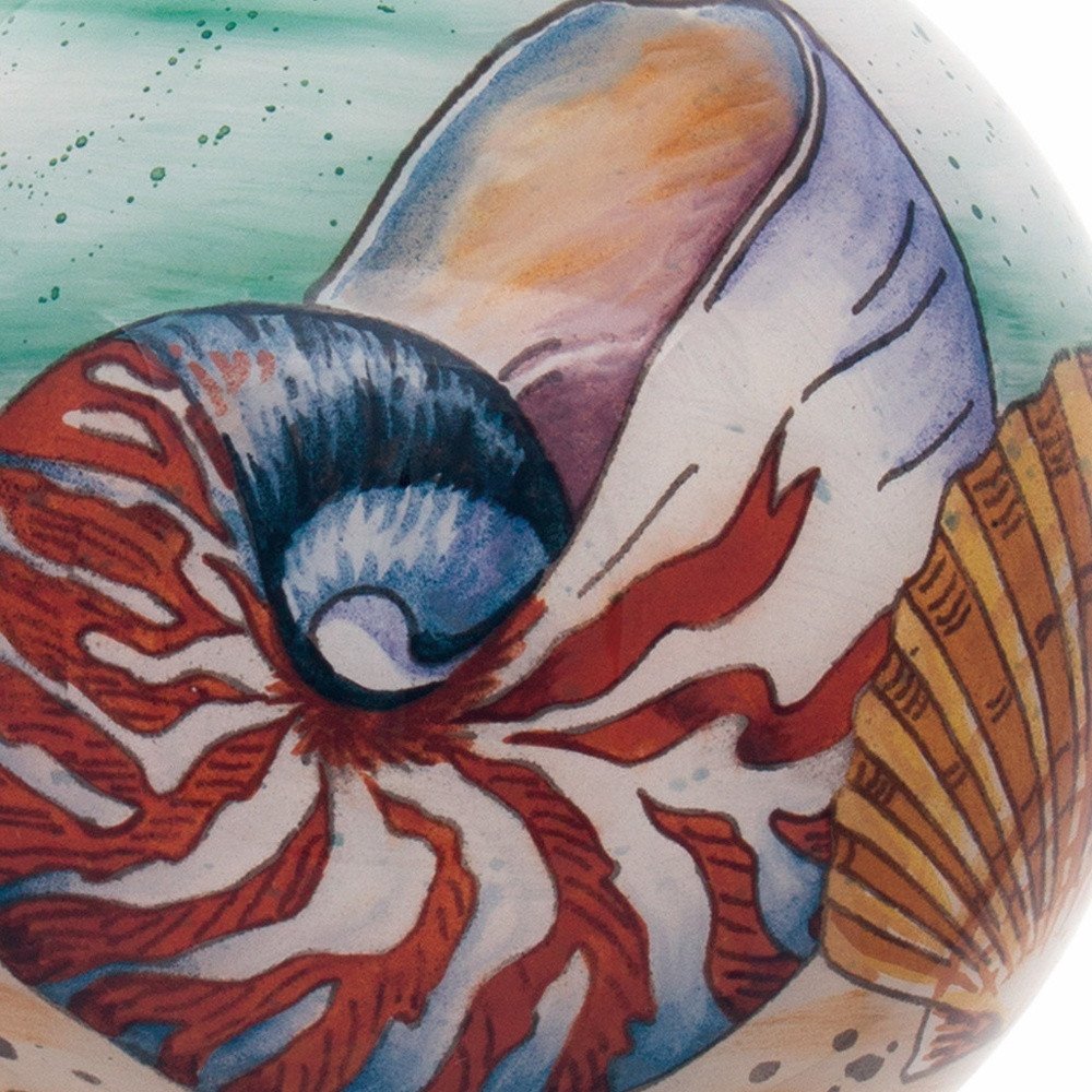 Sea Shell Hand Painted Mouth Blown Glass Ornament in a home interior