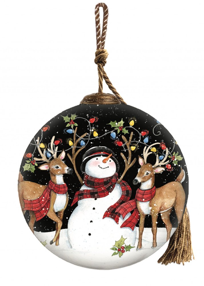 Round black glass Christmas ornament with a hand-painted scene of a snowman and two reindeer wearing scarves, surrounded by holiday lights.