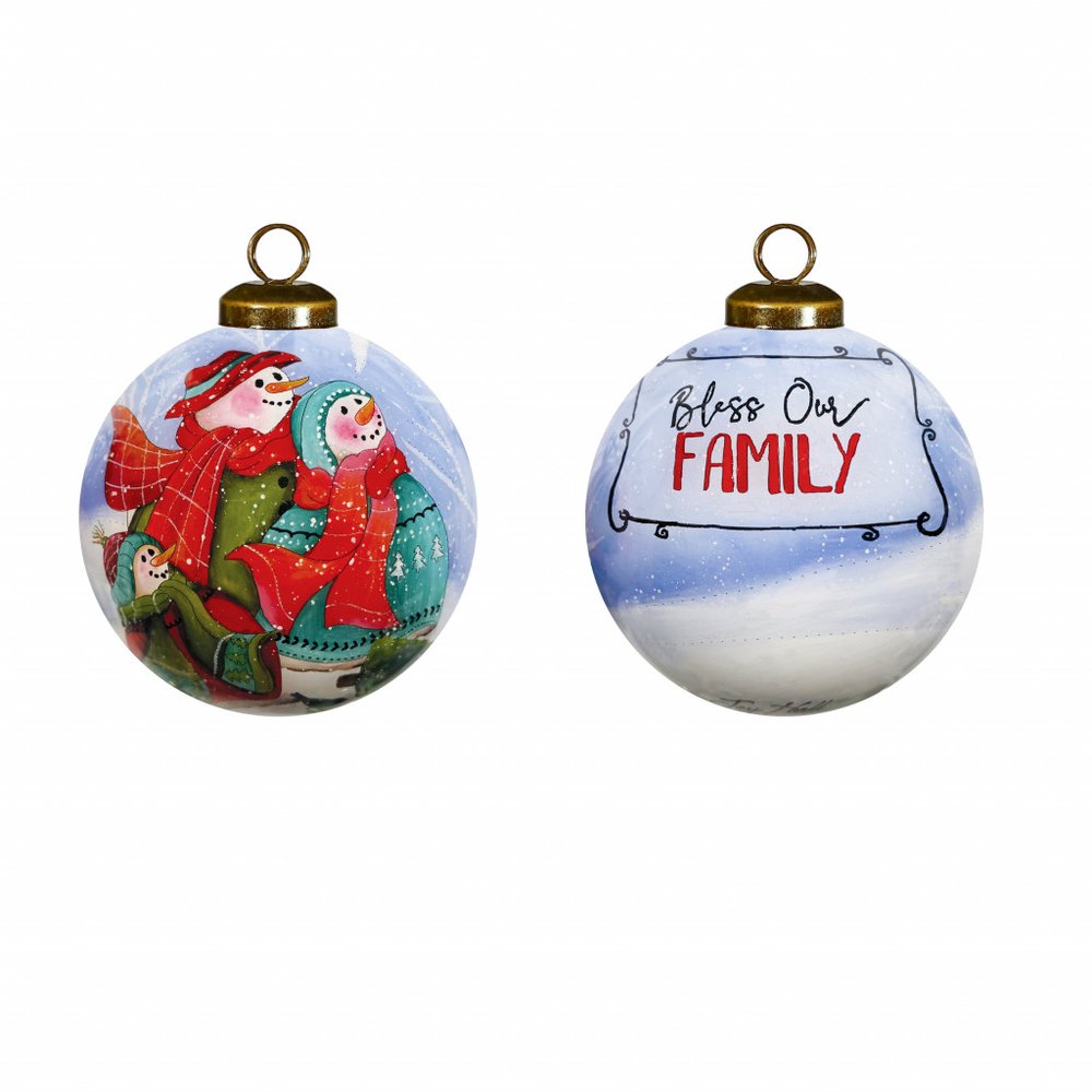 Hand-painted glass Christmas ornament with snowmen on one side and "Bless Our Family" text on the other, set against a snowy background.