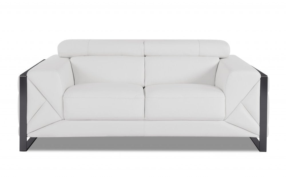 White Italian leather loveseat with black metal frame on a white background.