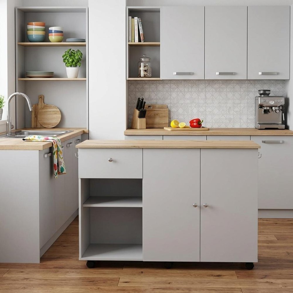 54" Natural and White Wood Flat Door Rolling Kitchen Island With Storage styled in a furnished interior with a light gray wall on a dark wood floor in tan wood.
