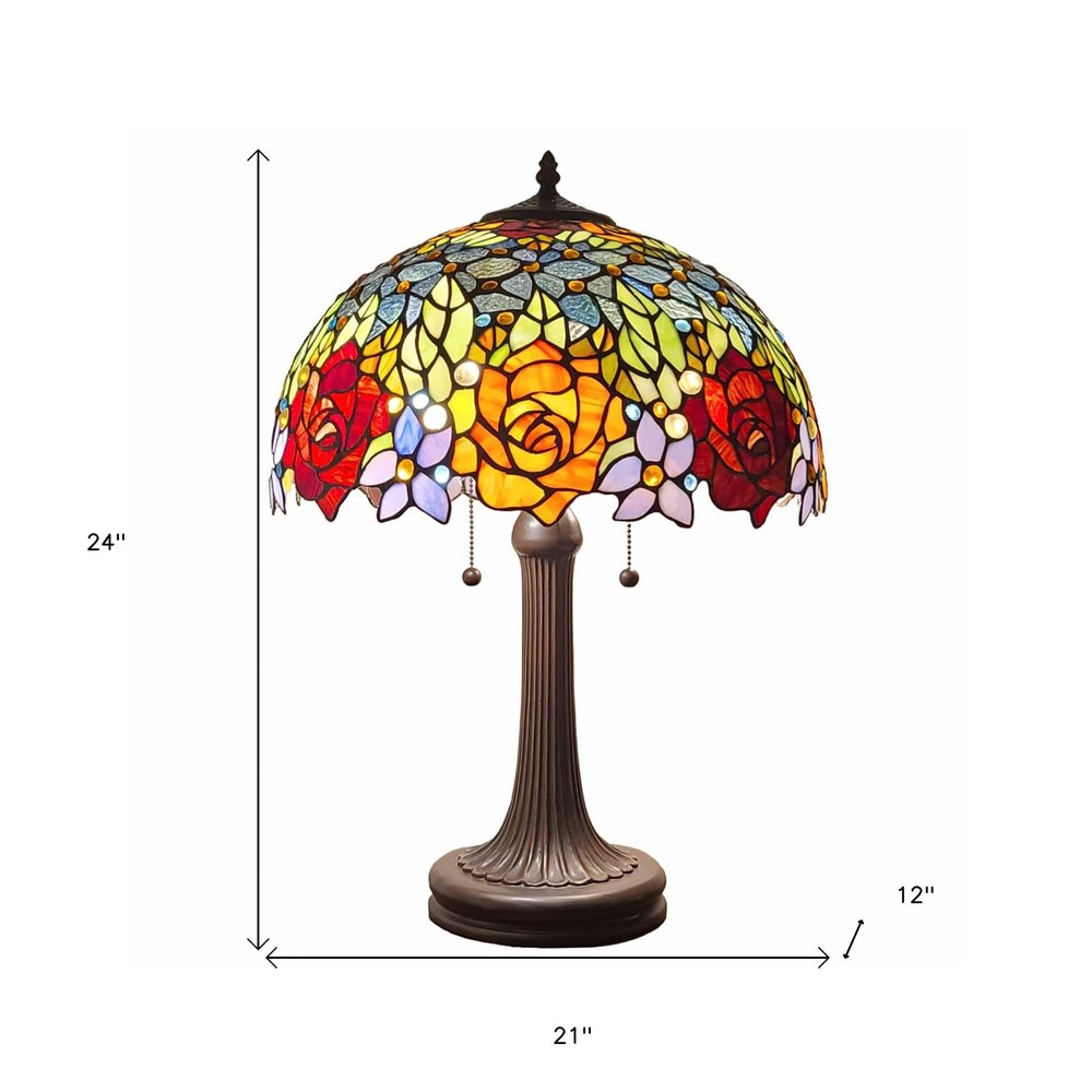 24" Dark Brown Metal Two Light Candlestick Table Lamp With Orange Shade. Table lamp isolated on a plain white background, in a dark brown metal finish.