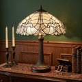 24" Dark Brown Metal Two Light Candlestick Table Lamp With Dark Brown Shade photographed against a dark studio background in dark brown.