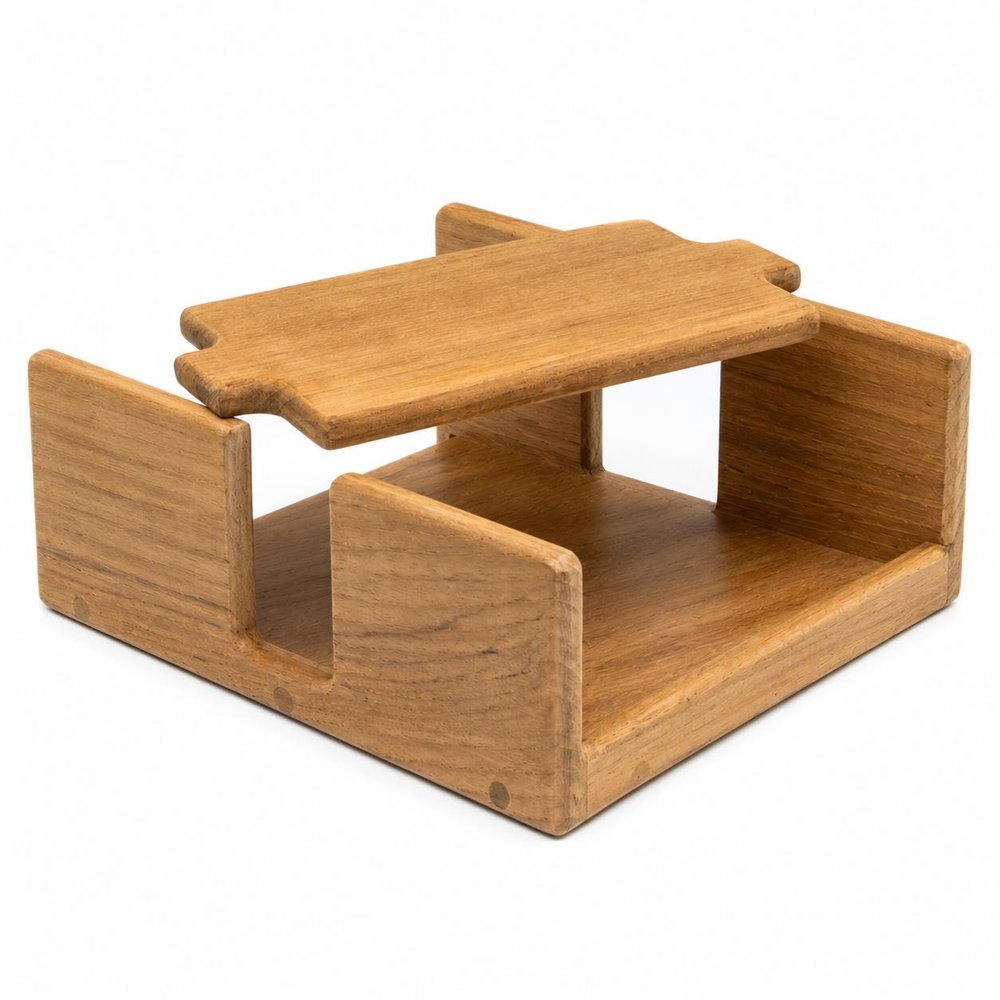 Wooden napkin holder with a natural wood finish on a white background.