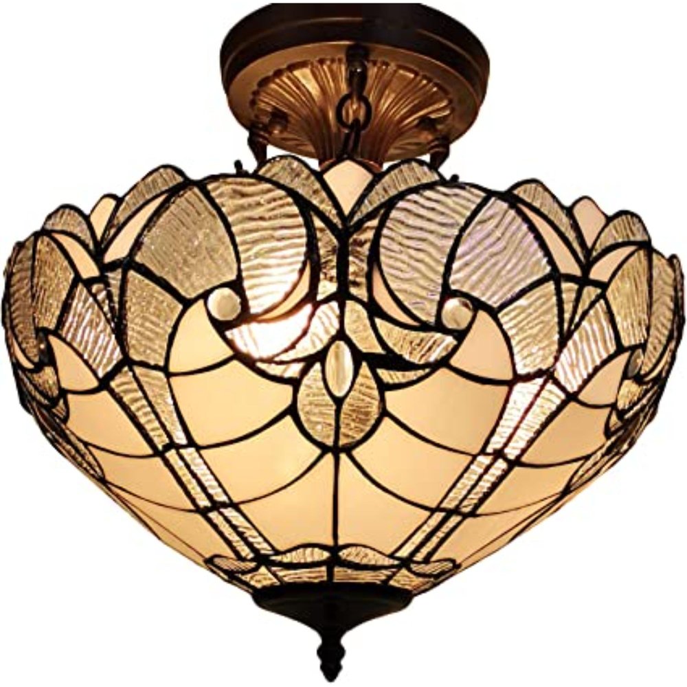 Yellow and brown Tiffany style semi-flush ceiling light with stained glass shade and dark metal accents.