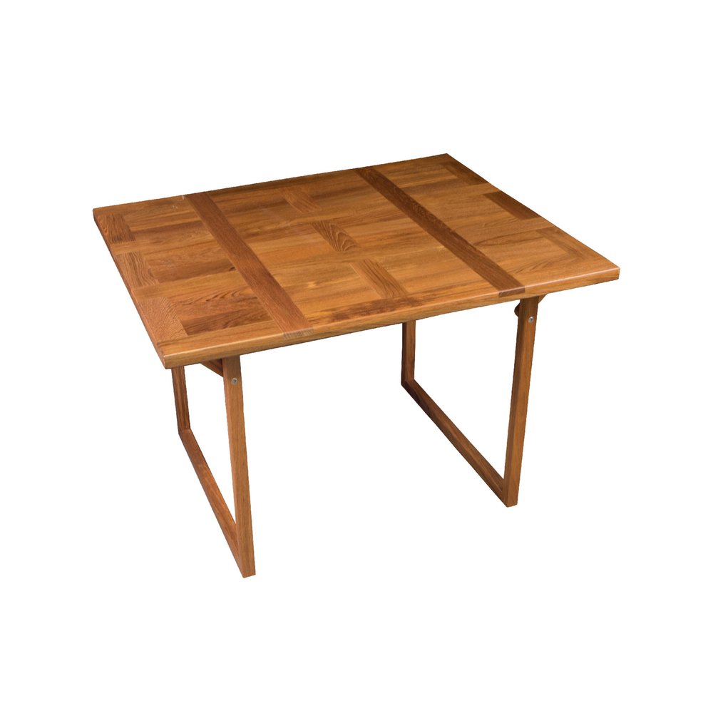 A brown solid wood folding side table with a parquet top and angled legs, isolated on a white background.