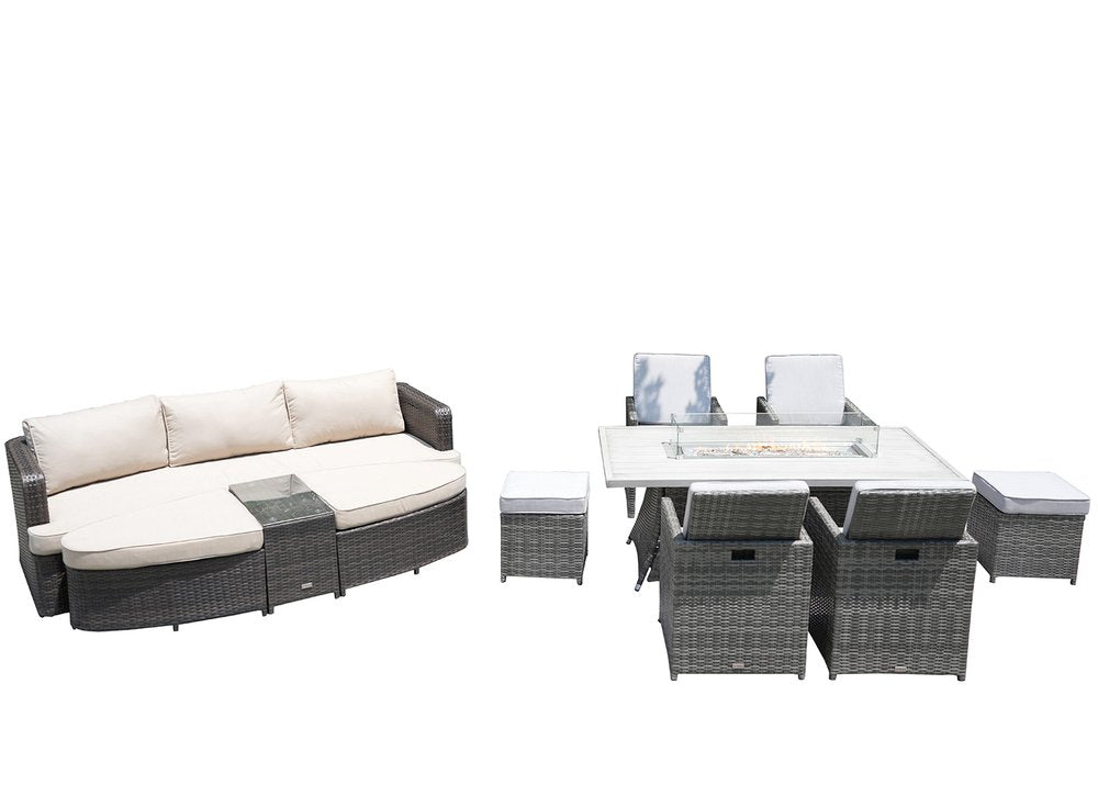 Gray wicker outdoor seating group with curved sofa, fire pit table, chairs, and ottomans on a white background.