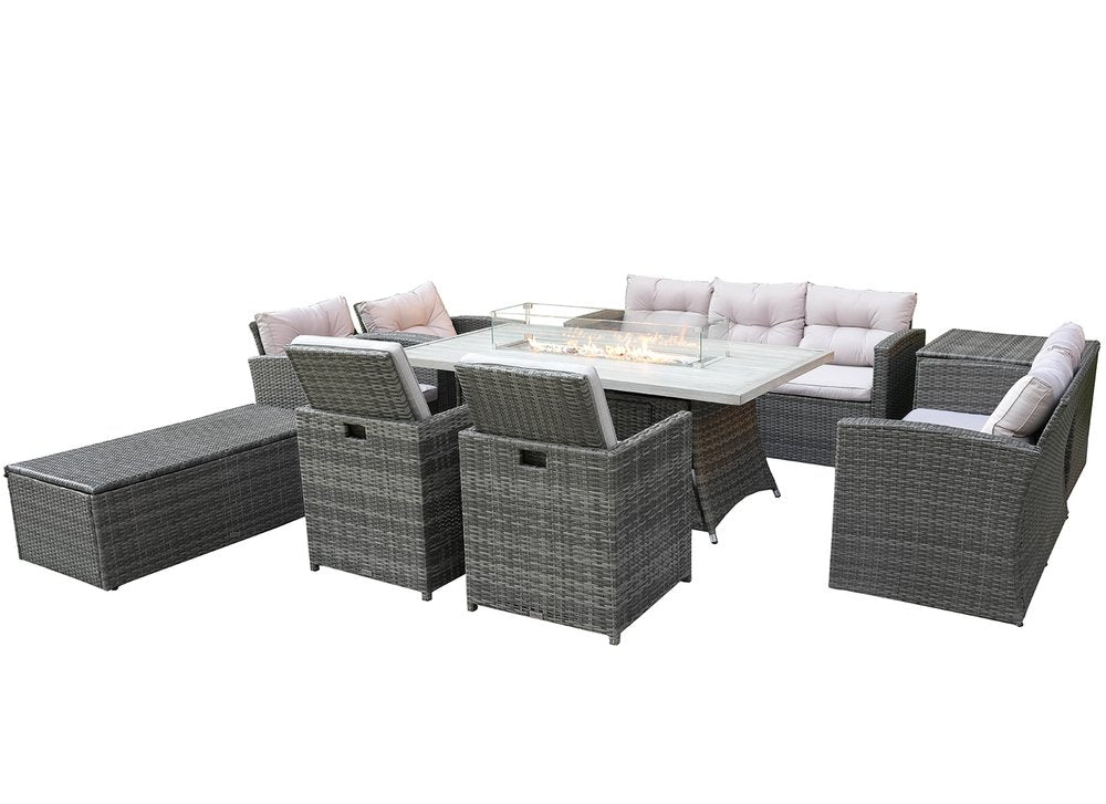 Gray wicker outdoor seating group with multiple chairs, a fire pit table, and a chaise lounge on a white background.