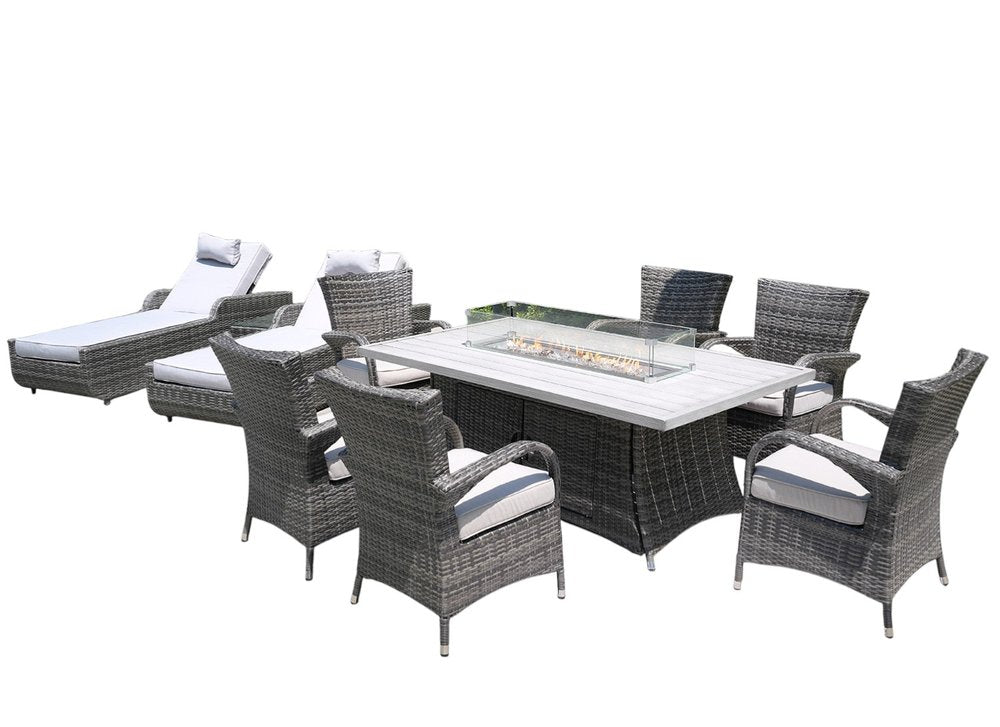 Gray wicker outdoor seating group with fire pit table, two chaise lounges, and six chairs with white cushions.