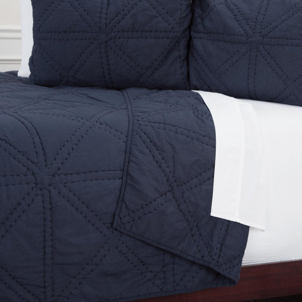 Set of Three Indigo Geometric King Quilt in a home interior