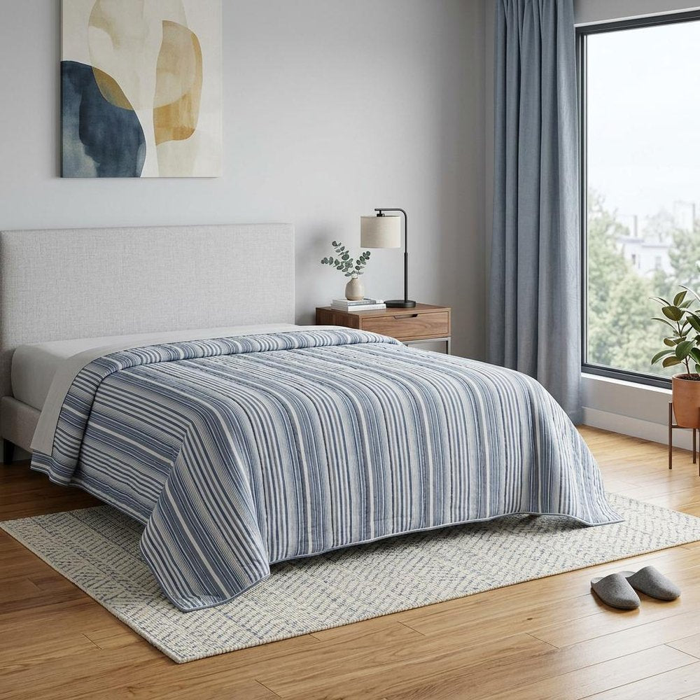 Blue And White Striped Queen Quilt in a home interior