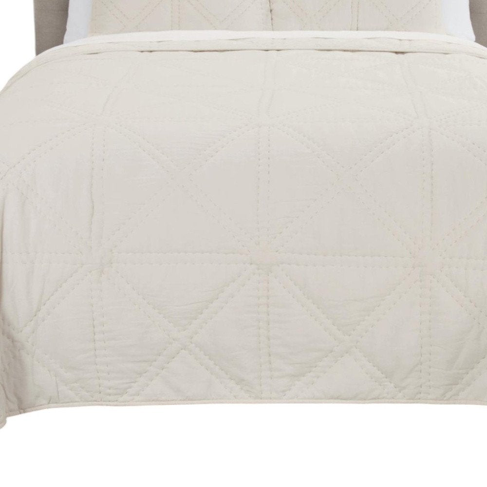 Set of Three Ivory Geometric Queen Quilt on a white background