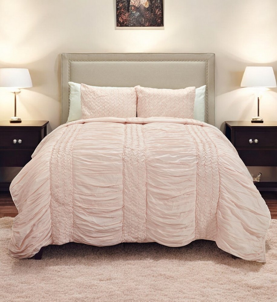 Pink Geometric Queen Quilt in a home interior
