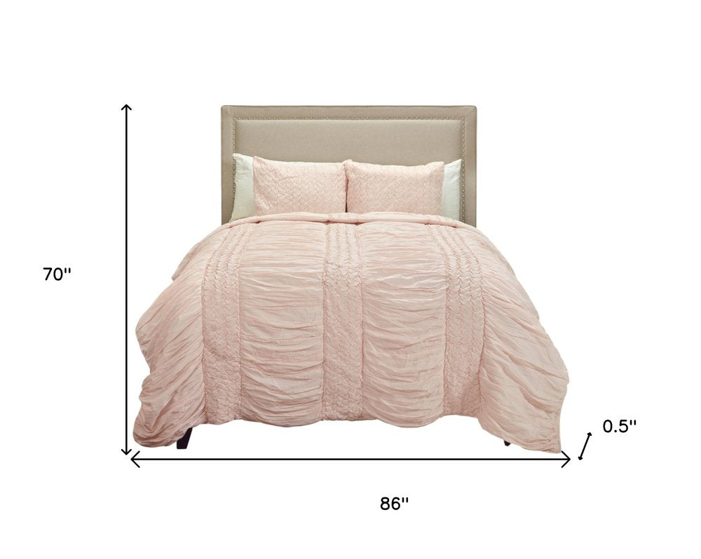 Pink Geometric Twin Quilt on a white background