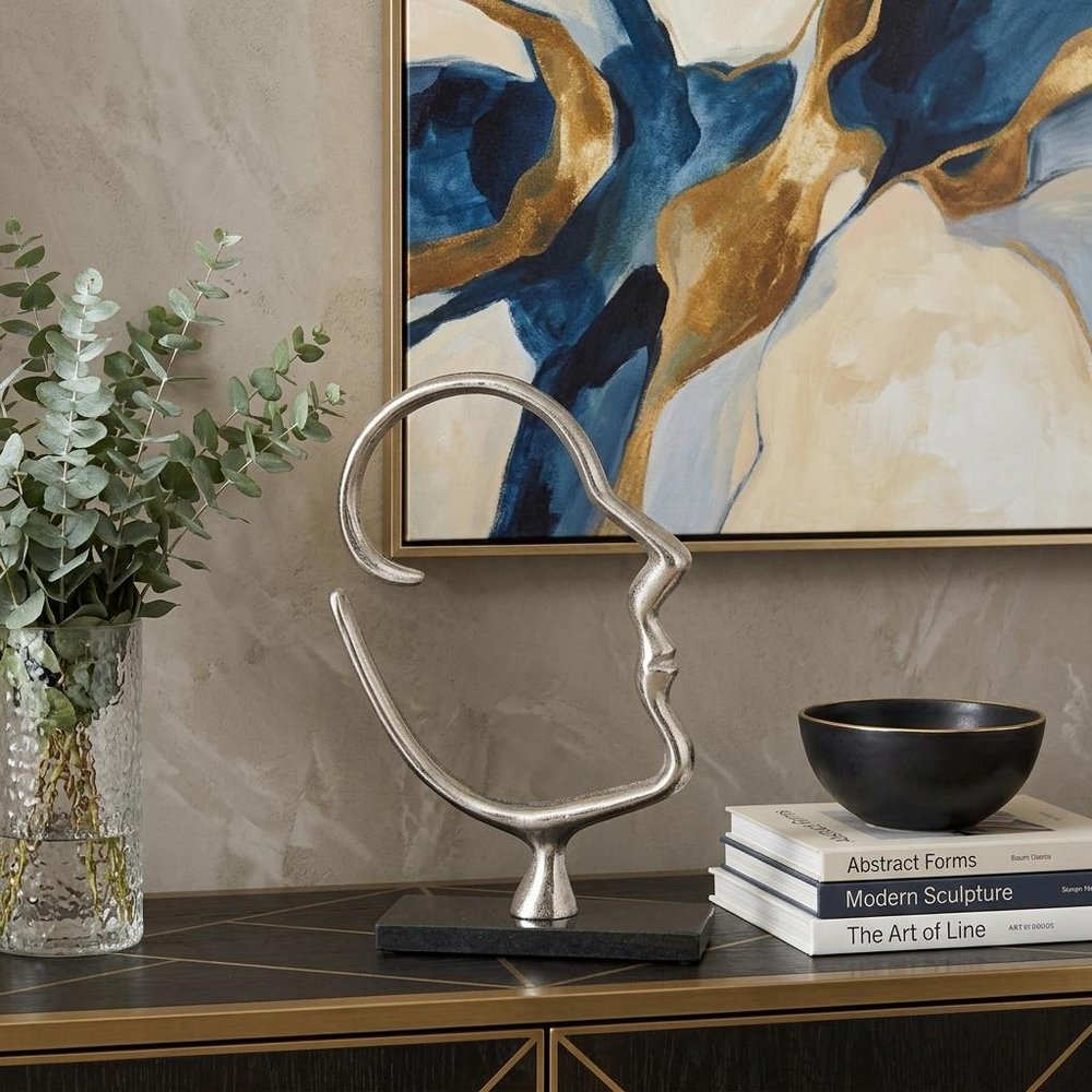 12" Black and Silver Marble and Aluminum Tabletop Sculpture shown outdoors on an outdoor setting.