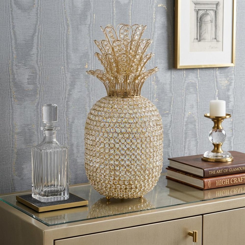 23" Glam Bling Faux Crystal and Silver Pineapple styled in a furnished interior with a light gray wall on a wood floor.