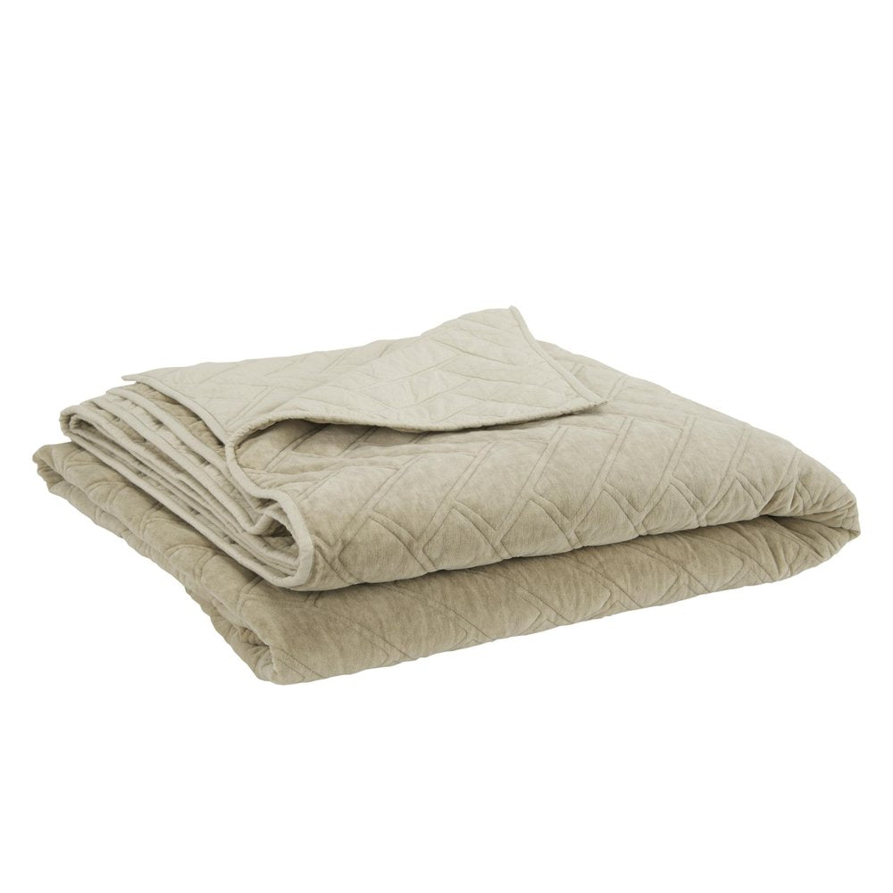 A beige quilted down alternative comforter folded on a white background.