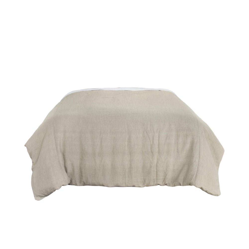 A stone-colored linen comforter with a white trim is shown on a white background.