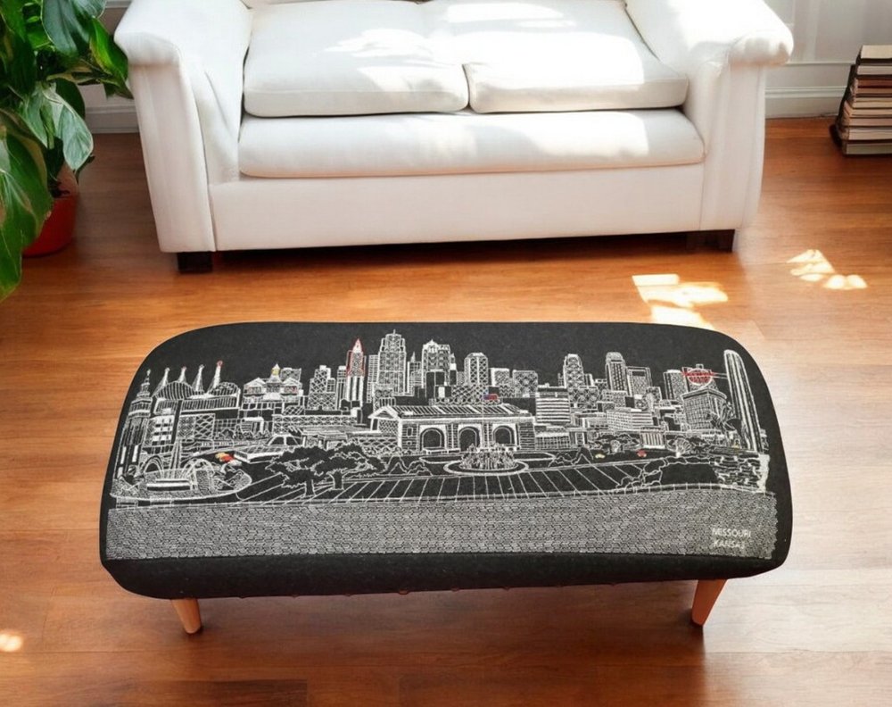 38" Black Wool and Brown Ottoman. Ottoman in black wool.