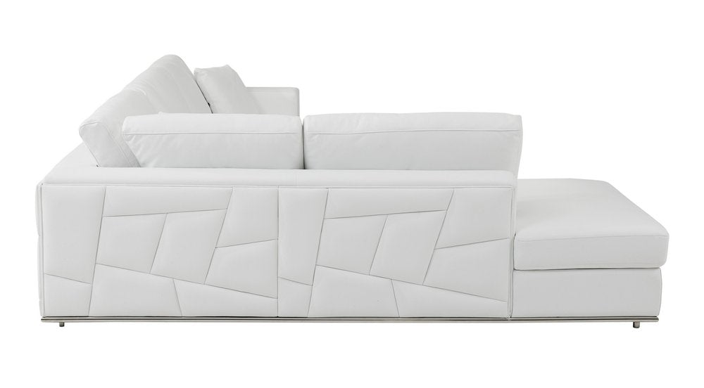 White Italian leather L-shaped sectional sofa with a geometric pattern on the side, shown from the side against a white background.