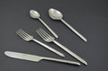 Glossy Silver Stainless Steel Twenty Piece Hand Forged Flatware Set close-up detail