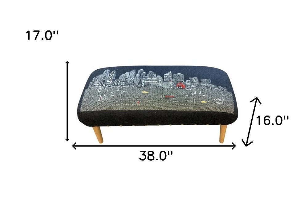 38" Black And Natural Boston Night Skyline Embroidered Ottoman. Ottoman isolated on a plain white background, showing its black color.