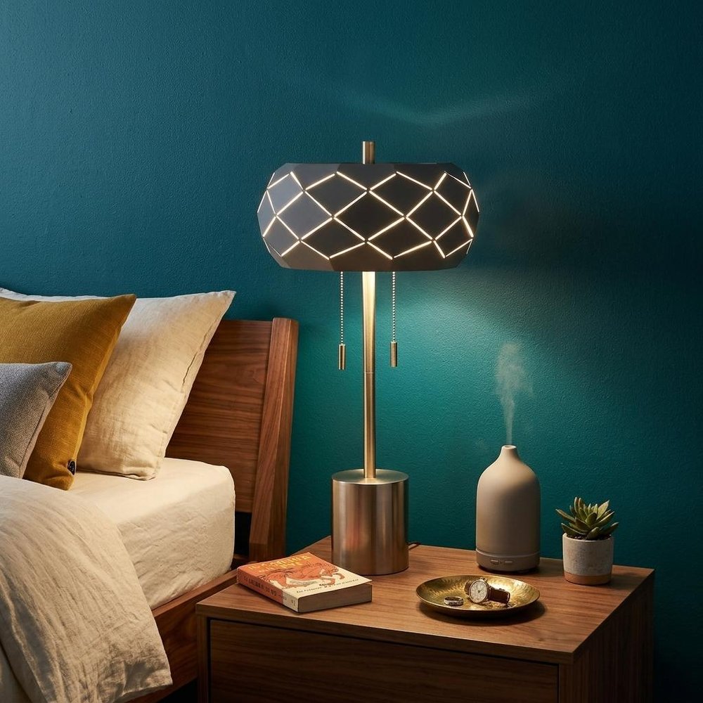 28" Silver Metal Table Lamp With Geometric Laser Cut Metal Shade shown outdoors on an outdoor setting.