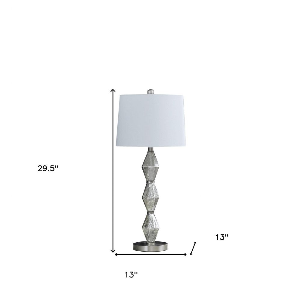 30" Brushed Silver Geo Glass Table Lamp With White Shade. Table lamp isolated on a plain white background, in a silver glass finish.