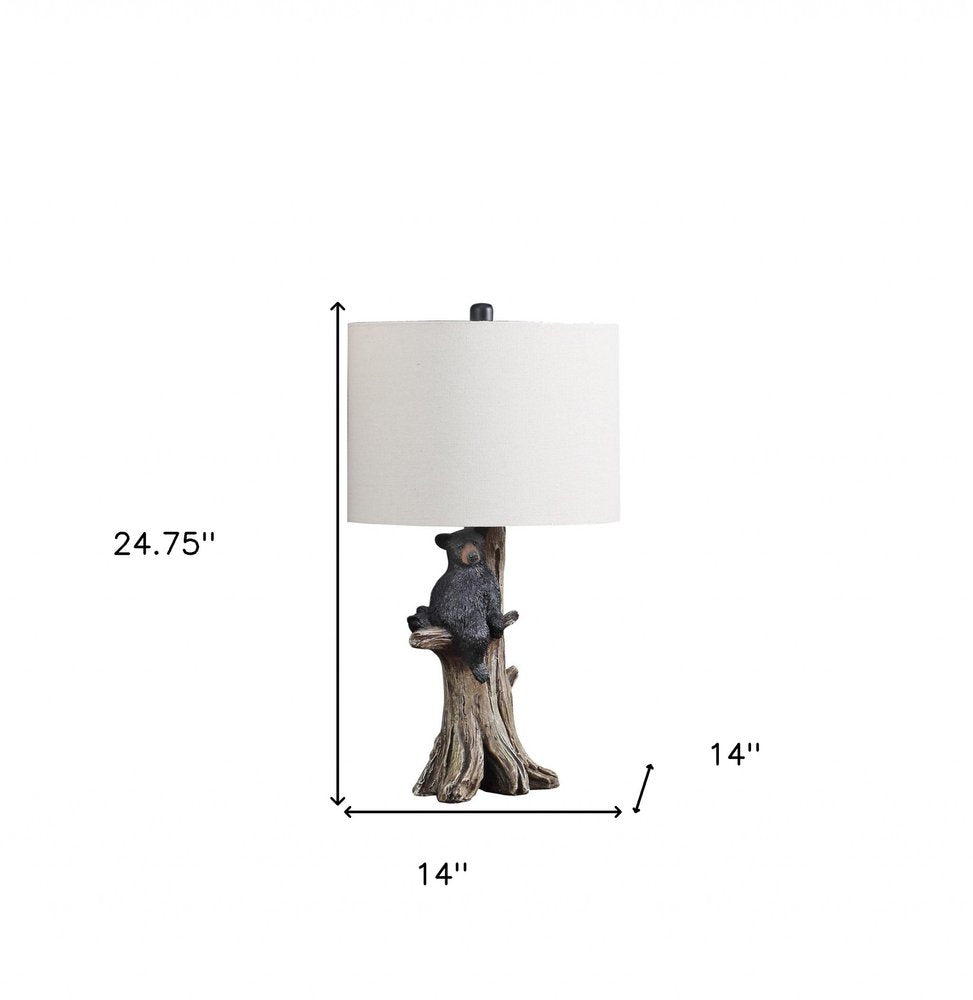 25" Black Bear in a Tree Table Lamp With Beige Shade. Table lamp isolated on a plain white background, in a beige finish.
