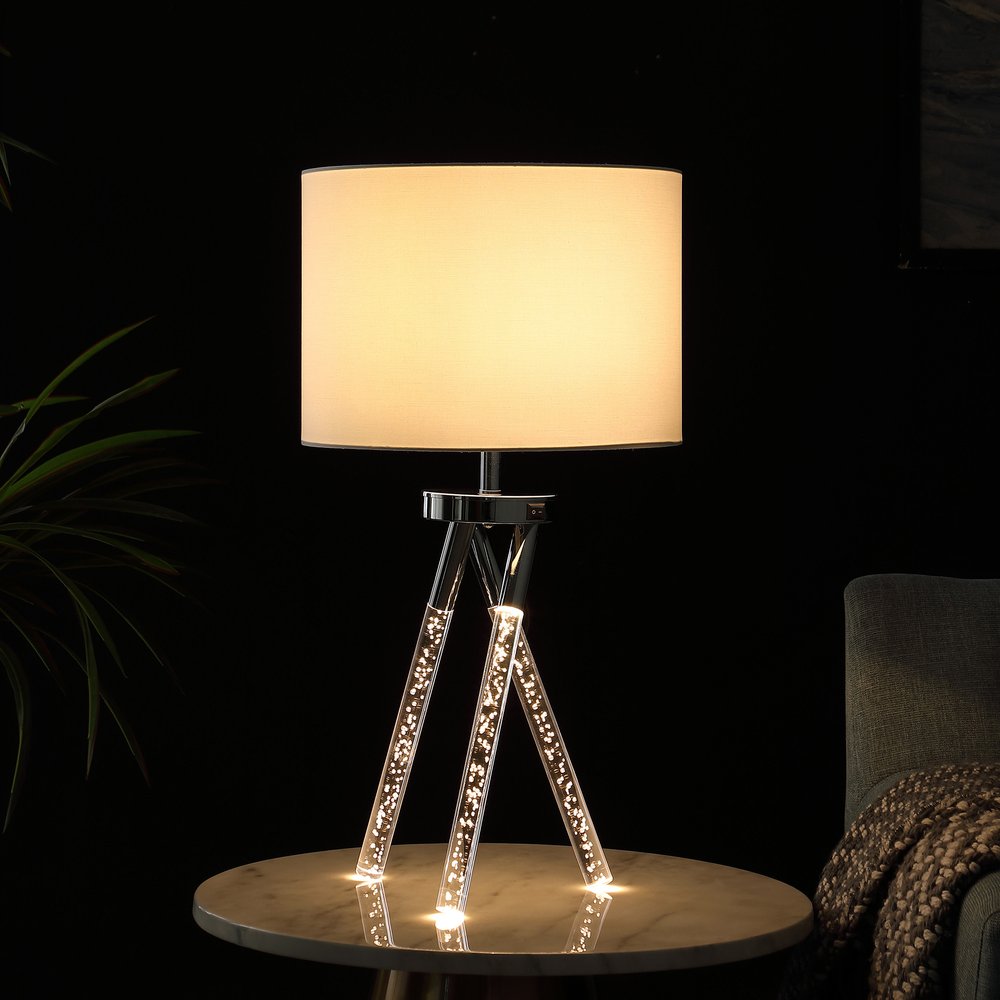 26" Silver and LED Acrylic Tripod Table Lamp With White Shade photographed against a dark studio background.