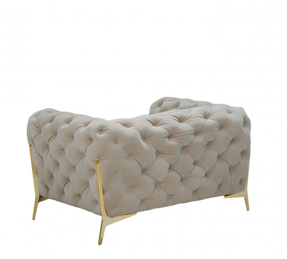 50" Beige And Gold Velvet Tufted Lounge Chair. Accent chair isolated on a plain white background, in a beige velvet finish.