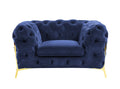 Blue velvet tufted lounge chair with gold legs on a white background.