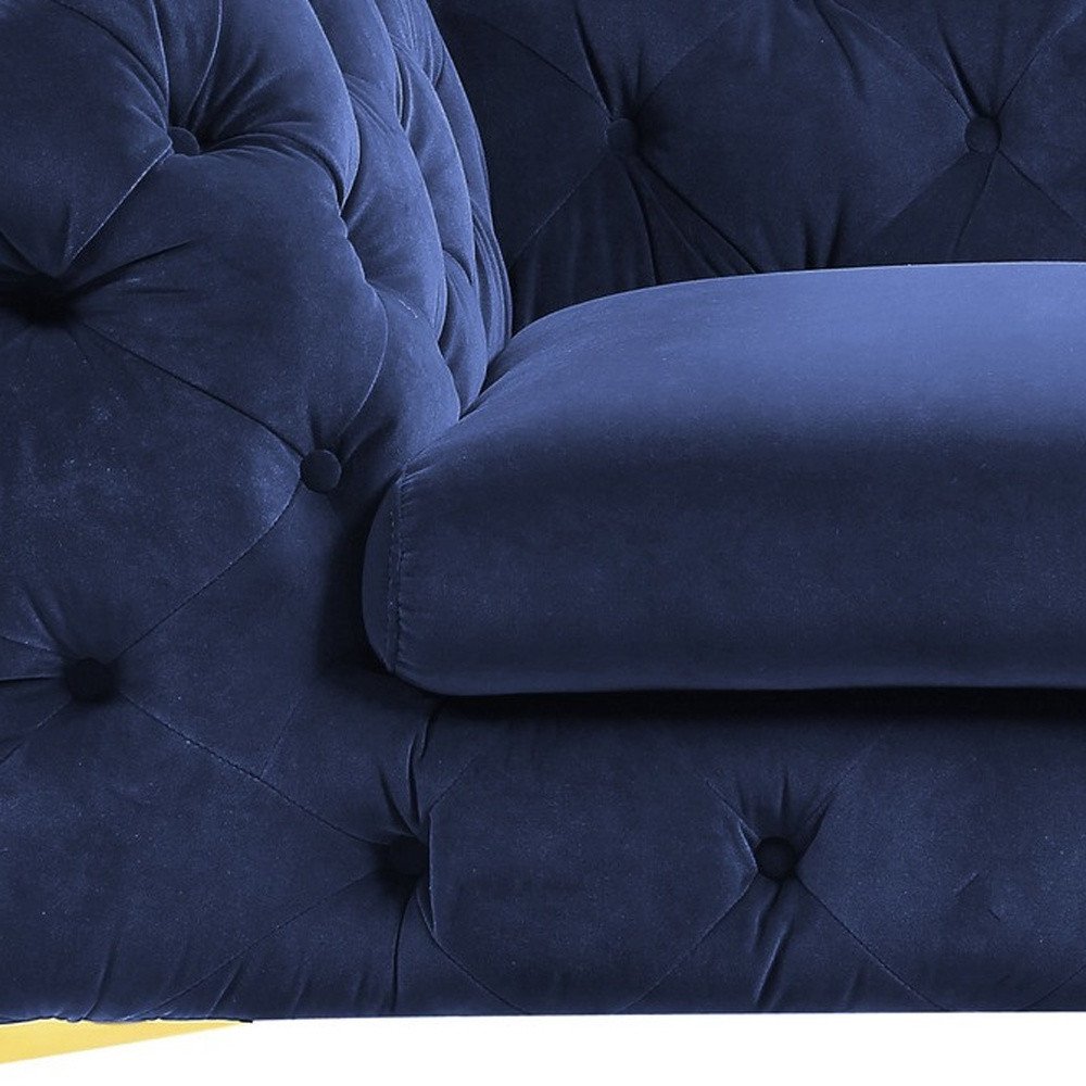 Close-up of 50" Blue And Gold Velvet Tufted Lounge Chair showing the blue velvet texture.