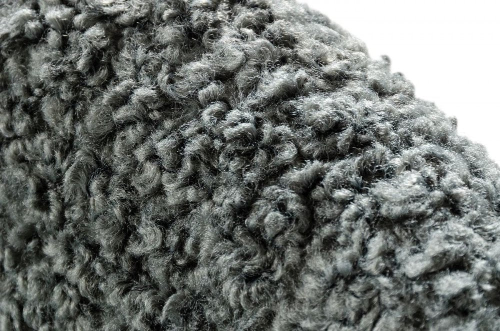 Close-up of 30" Gray and Brown Faux Fur Metal And Solid Wood Rocking Chair showing the gray wood texture.