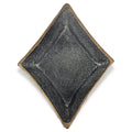 Black cast iron diamond-shaped bowl with a gold rim on a white background.