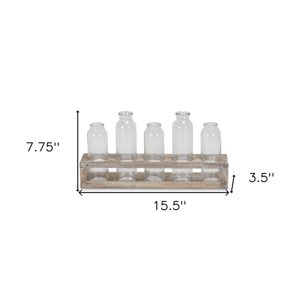 Set of Five Clear Cylinder Glass Decorative Bottles on a white background