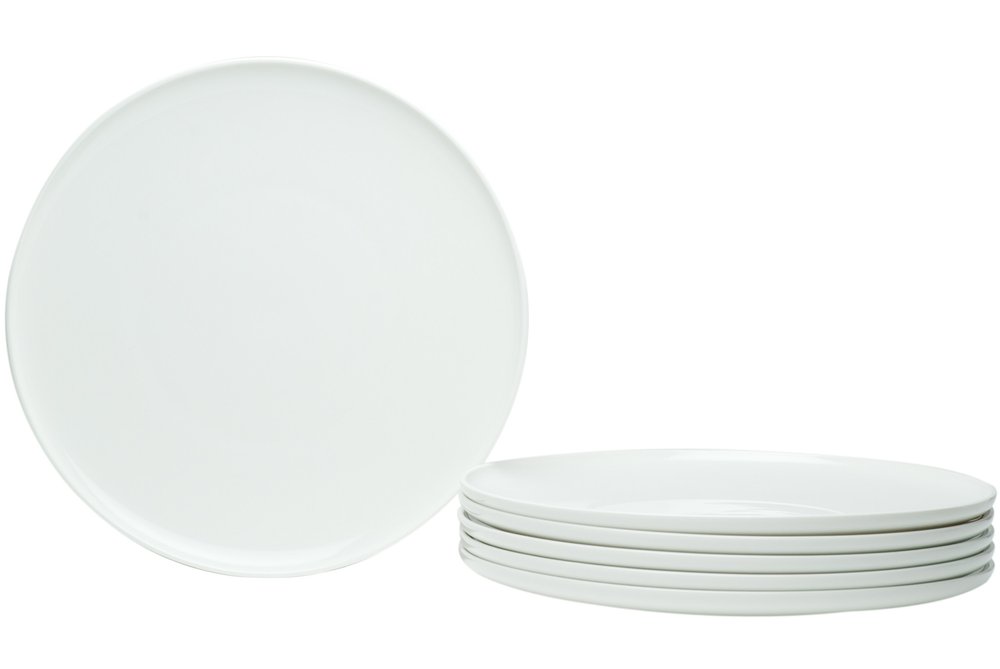 A stack of six white porcelain dinner plates and one large white porcelain dinner plate on a white background.