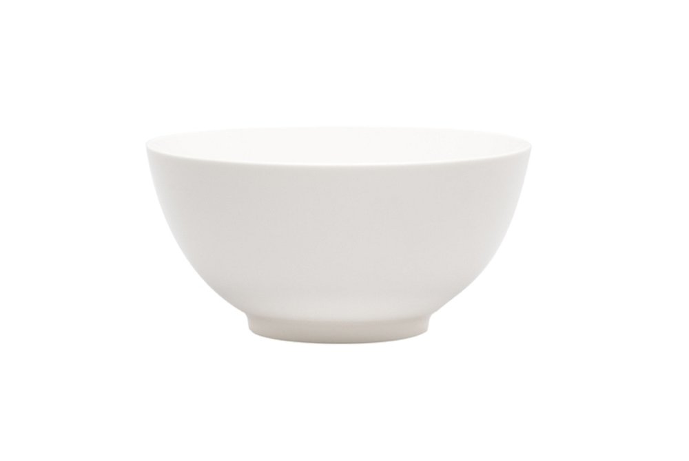 White porcelain large round serve bowl on a white background.