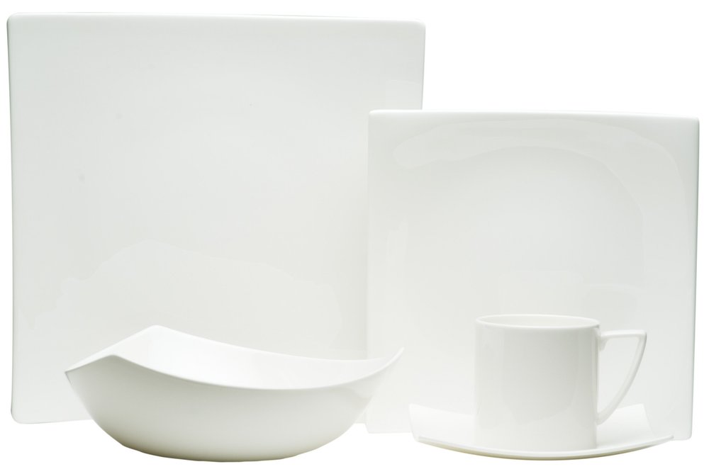 White five-piece square bone china dinnerware set on a white background, including plates, a bowl, and a cup and saucer.