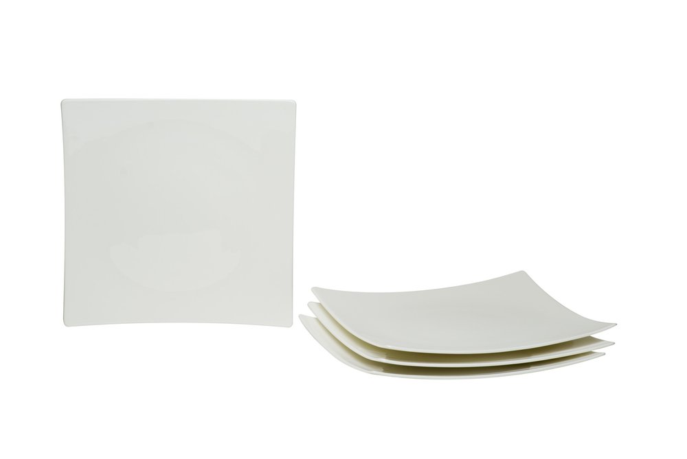 White bone china square salad plates stacked and one plate standing against a white background.