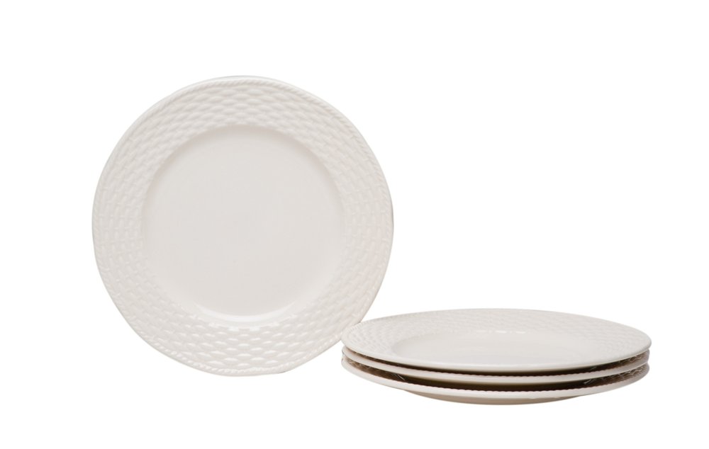 White stoneware salad plates with a woven texture on the rim, stacked on a white background.