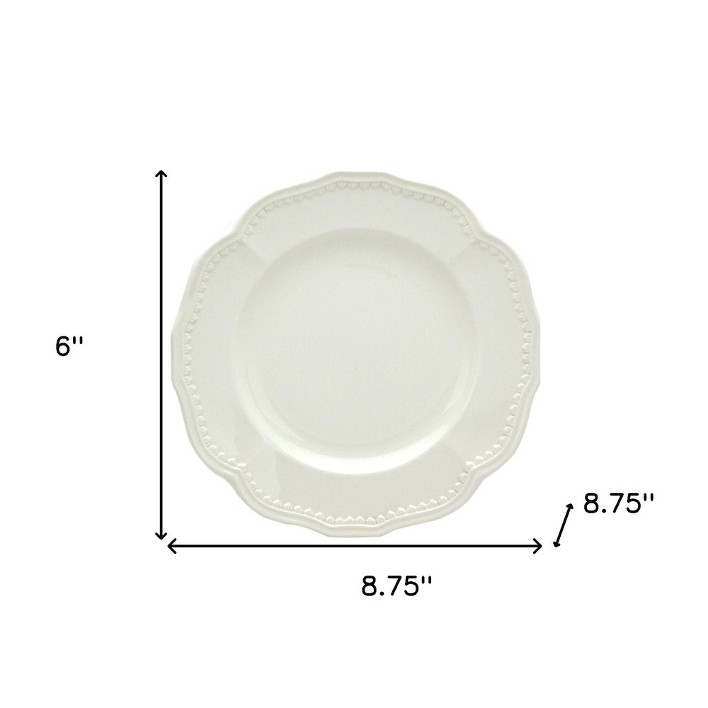 White Four Piece Round Scallop Stoneware Service For Four Salad Plate Set on a white background