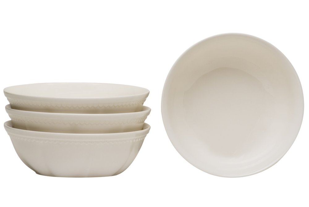 Four white stoneware bowls stacked on the left, with one bowl shown open on the right, against a white background.