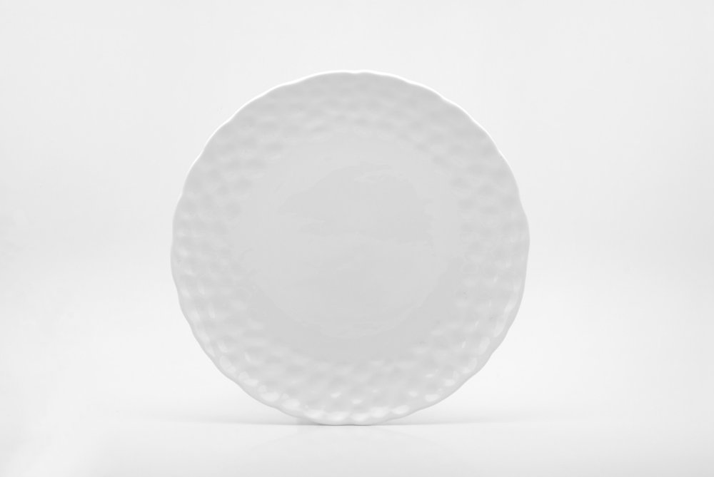 White Six Piece Round Pebbled Porcelain Service For Six Dinner Plate Set on a white background