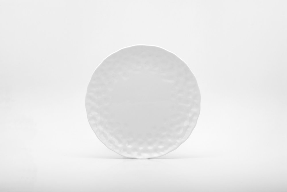 White Six Piece Round Pebbled Porcelain Service For Six Salad Plate Set on a white background