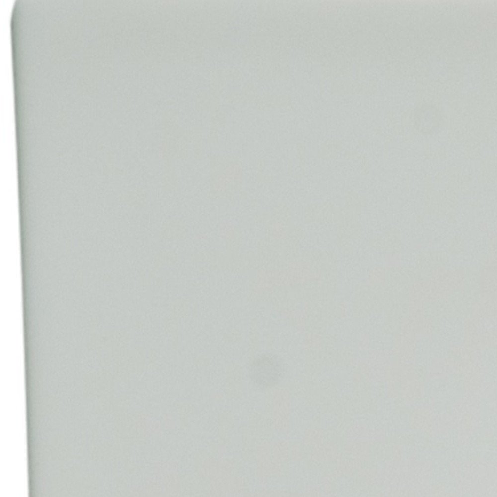 White bone china dinnerware set with a subtle floral pattern, close-up view.