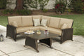 Two Piece Brown and Tan Metal Sectional Seating Group With Table in a home interior