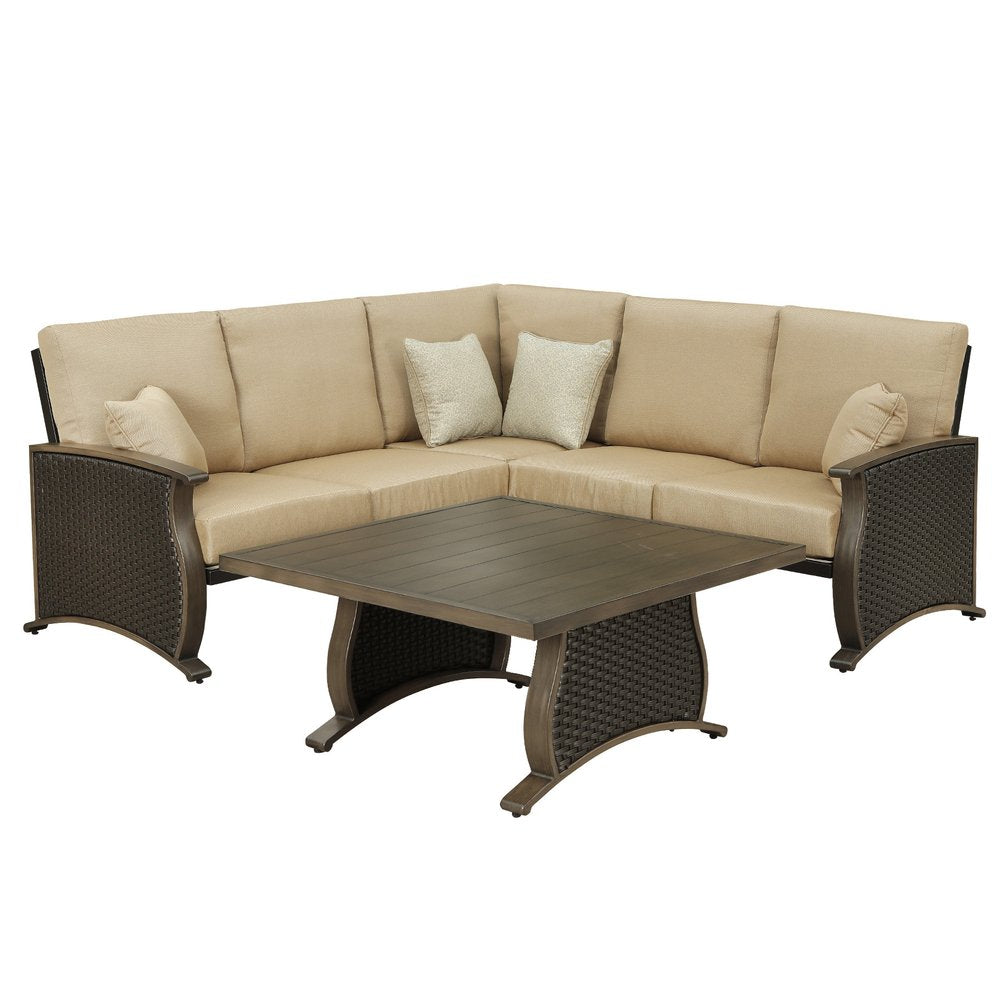 Two Piece Brown and Tan Metal Sectional Seating Group With Table on a white background