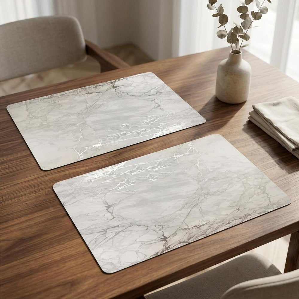12" X 18" Silver And Gray Abstract Placemats styled in a furnished interior with an off-white wall on a dark wood floor.